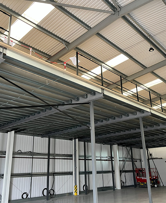 industrial warehouse interior featuring high ceilings balcony area and equipment storage space six storage options available 6 loading areas