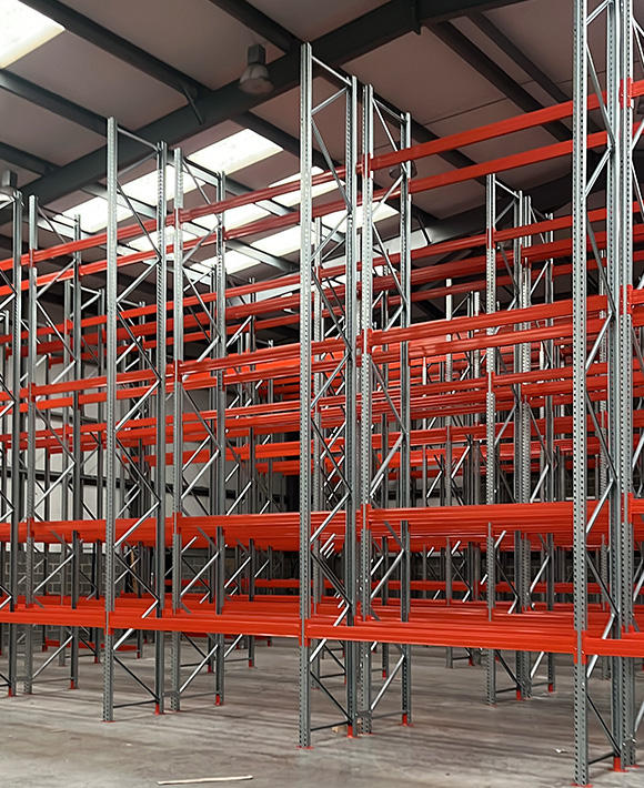warehouse shelving units with orange metal beams and vertical supports arranged in rows for storage 10 shelving options available