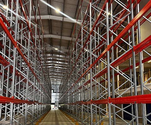 interior view of a warehouse with tall metal shelving units organized in neat rows showcasing an efficient storage setup ideal for 16 pallets wide and deep designed for optimal inventory management