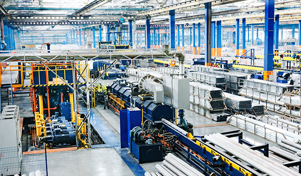 industrial manufacturing facility with machinery and conveyor systems showing efficient production processes in a spacious layout featuring three main production lines