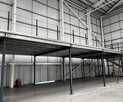 industrial mezzanine storage area with steel construction and interior shelving