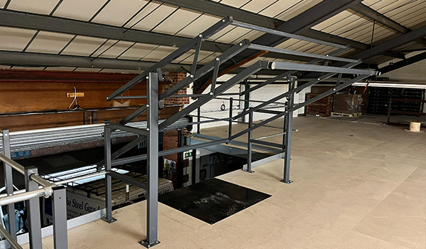 metal stairs installation with dual handrails and open space above